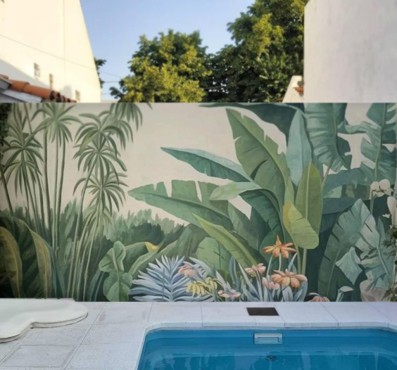 muro decorado con paisaje tropical